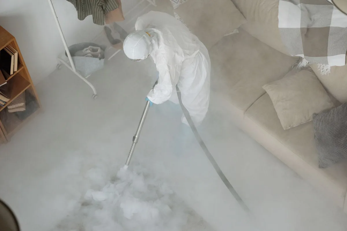 Biohazard cleanup technician in protective equipment, Purdy, MO